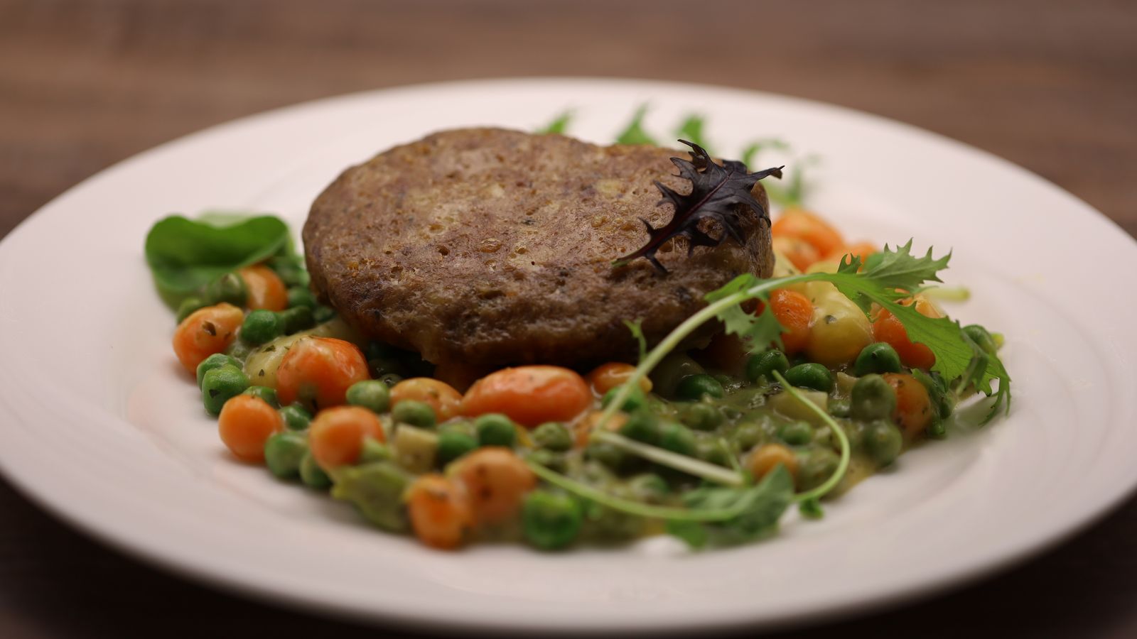 Fried minced cheese patty on hollandaise vegetables